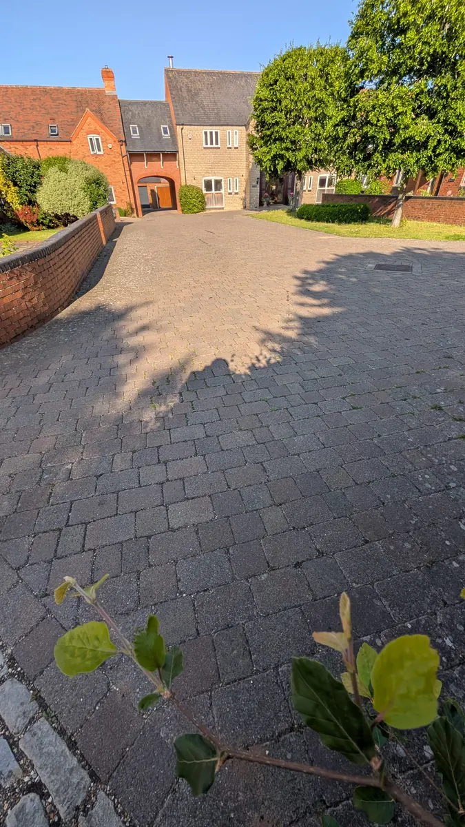 Paved surface before pressure washing in Ipswich